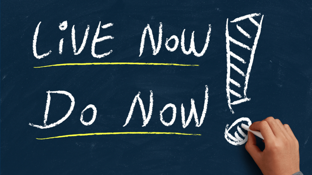 Words Live Now Do Now! written on the blackboard with a chalk