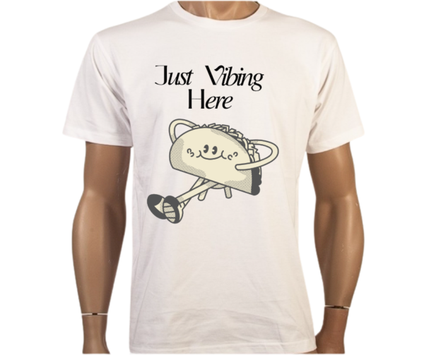 Funny Taco T-Shirt featuring a smiling taco character and "Just Vibing Here" text. Made from 100% combed cotton, lightweight and breathable for casual wear.